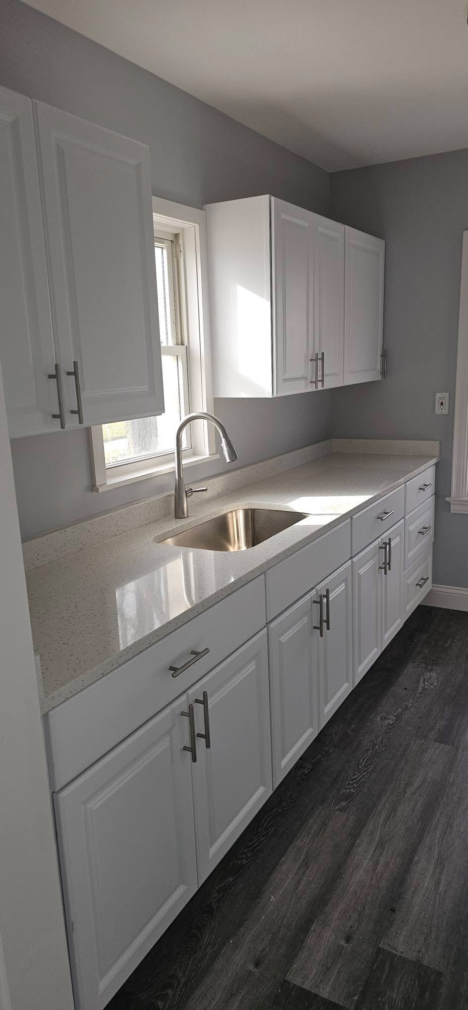 Kitchen detail — quartz countertop and stainless sink