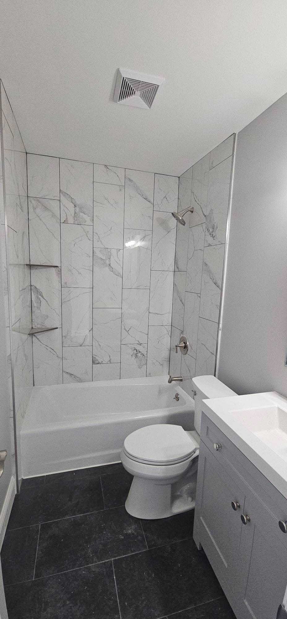 Renovated bathroom with marble tile